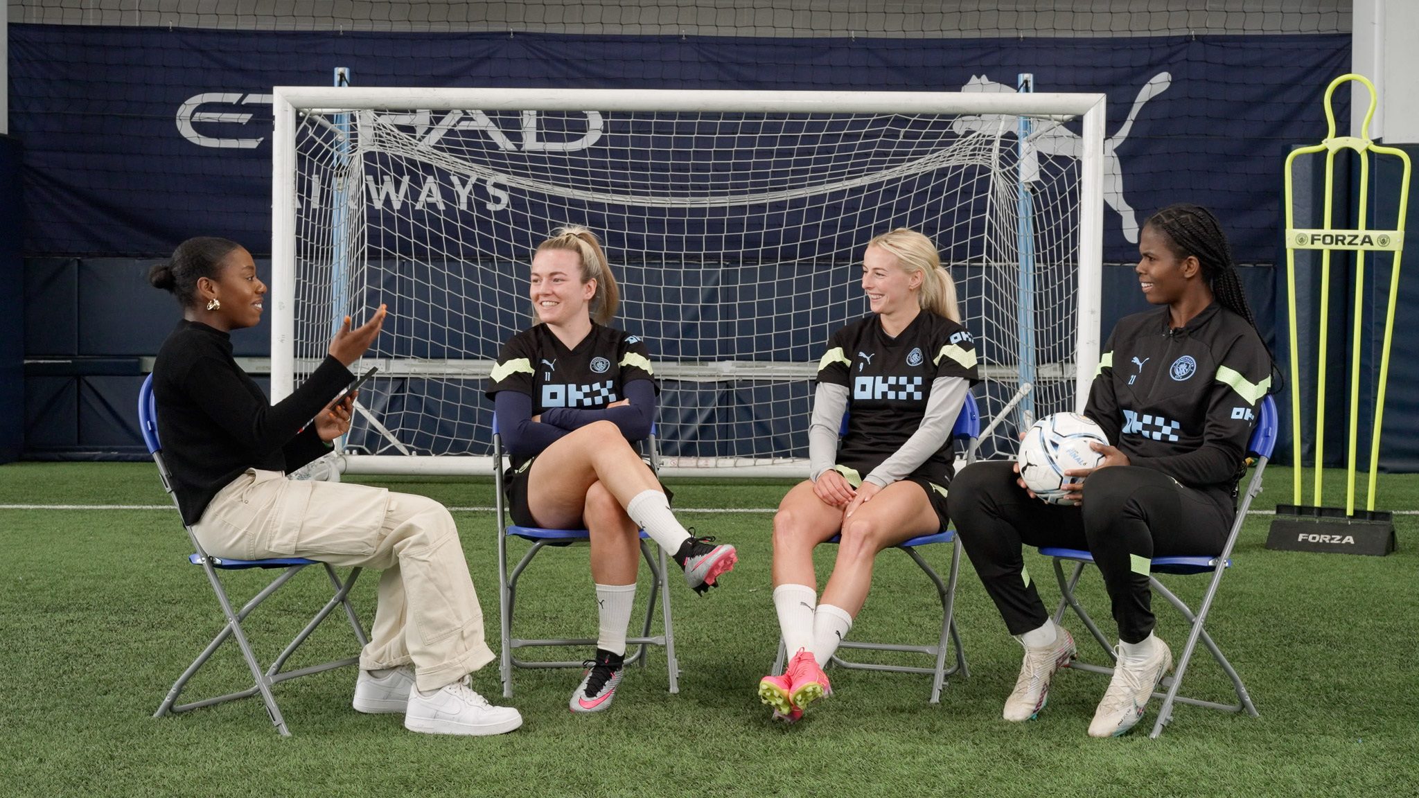 Arsenal women players interview shoot at Emirates Stadium training pitch London